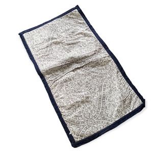 Two gray and cream king size quilted pillow covers trimmed in navy